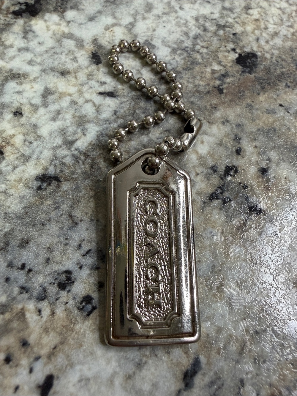 Coach Silver Tone Embossed Tag Keychain